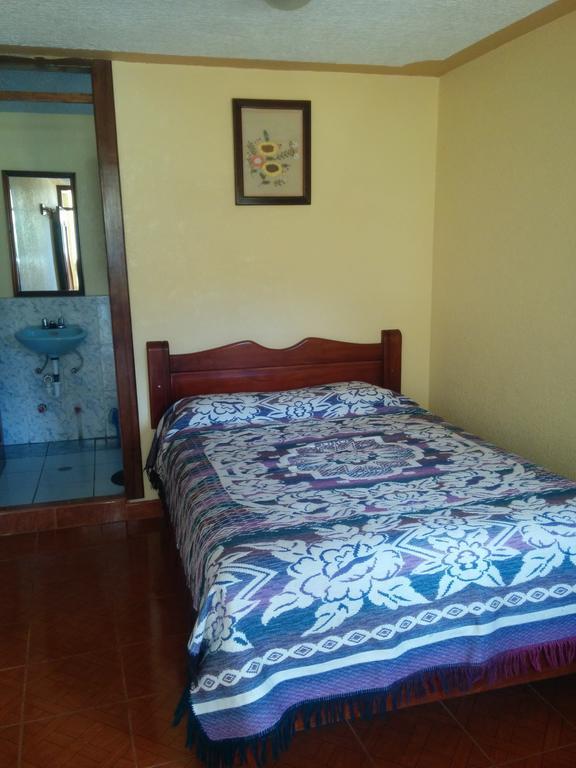 Hostal Curinan Отавало Номер фото